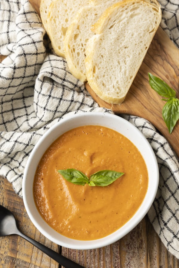 https://www.foodiewithfamily.com/wp-content/uploads/2022/08/Creamy-Tomato-Basil-Soup-2-600x900.jpg