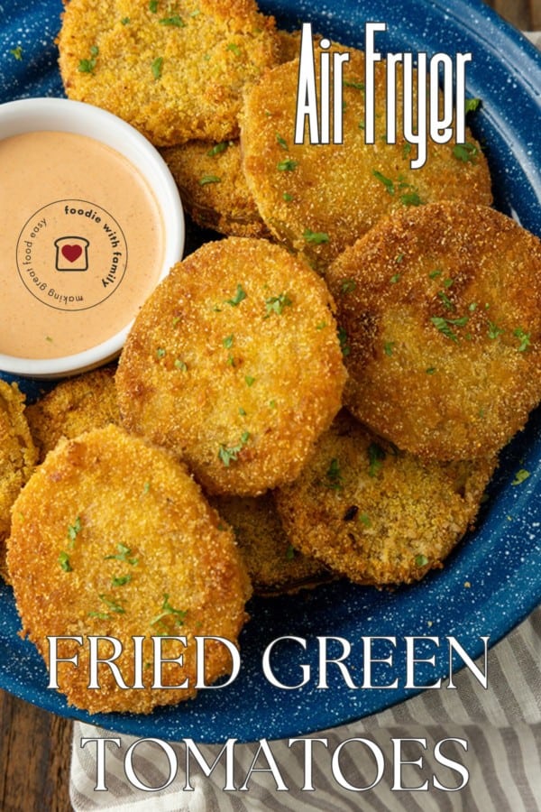 fried green tomatoes on a blue enamel plate with a bowl of dip and text describing the photo overlaying it.